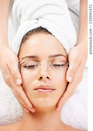Spa massage, peace and hands on face of woman from above at resort for stress relief or wellness. Top view, facial and female client with masseuse at beauty salon for luxury, skincare or dermatology 138991471