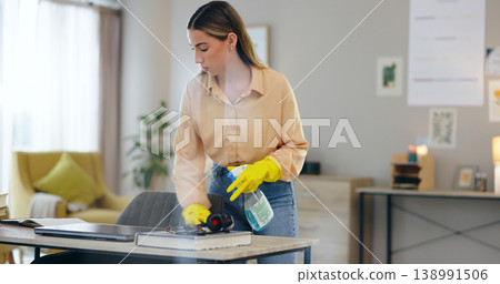 Woman, spray bottle and cleaning table in house, disinfection and maintenance service or fluid. Female person, gloves and antibacterial or detergent, chemical and hygiene or bacteria in home office Woman, spray bottle and cleaning table in house, disinfection and maintenance service or fluid. Female person, gloves and antibacterial or detergent, chemical and hygiene or bacteria in home office 138991506
