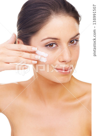 Portrait, hand and cream with a beauty woman in studio isolated on a white background for natural wellness. Face, skincare and facial lotion or cosmetics with a confident young model looking perfect Portrait, hand and cream with a beauty woman in studio isolated on a white background for natural wellness. Face, skincare and facial lotion or cosmetics with a confident young model looking perfect 138991507