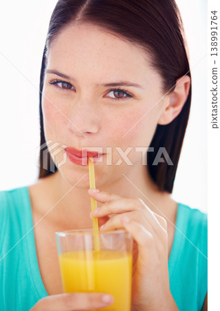 Health, drink and portrait of woman with juice for nutrition, wellness and hydration in studio. Happy, thirsty and face of person with fruit blend for vitamins, detox and diet on white background 138991764