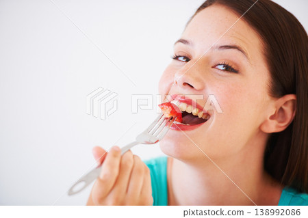 Health, happy and portrait of woman with strawberry eating for nutrition, wellness and snack in studio. Food, balance diet and face of person for vitamins, detox and lose weight on white background Health, happy and portrait of woman with strawberry eating for nutrition, wellness and snack in studio. Food, balance diet and face of person for vitamins, detox and lose weight on white background 138992086