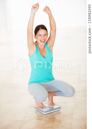 Woman, lose weight and happy. with check on scale in bathroom with success, achievement or surprise. Healthy, diet and person celebrate measurement, numbers and proud of wellness, goal and happiness Woman, lose weight and happy. with check on scale in bathroom with success, achievement or surprise. Healthy, diet and person celebrate measurement, numbers and proud of wellness, goal and happiness 138992095