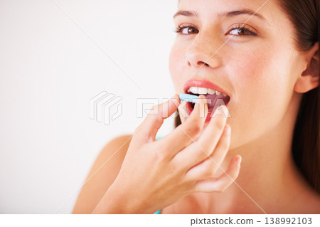 Healthy, woman and portrait with pill, tablet and supplements for nutrition, diet or vitamin c benefits. Happy, face and girl eating pharmaceutical capsule with omega 3, iron and healthcare medicine Healthy, woman and portrait with pill, tablet and supplements for nutrition, diet or vitamin c benefits. Happy, face and girl eating pharmaceutical capsule with omega 3, iron and healthcare medicine 138992103