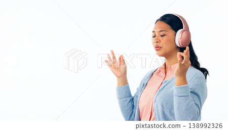 Woman, meditation and headphones, listening to calm audio, podcast and peace in studio on banner mockup. Asian person with music subscription for yoga, lotus hands or zen isolated on white background Woman, meditation and headphones, listening to calm audio, podcast and peace in studio on banner mockup. Asian person with music subscription for yoga, lotus hands or zen isolated on white background 138992326