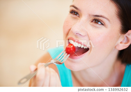 Health, diet and face of woman with tomato eating for nutrition, wellness and snack for hunger. Food, happy and smile of person with vegetable salad for vitamins benefits, detox and lose weight 138992632