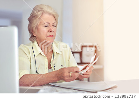 Senior woman, planning budget and retirement or paperwork for tax, financial documents or receipt, investment or savings. Elderly person, finance or money or pension, bills or debt management Senior woman, planning budget and retirement or paperwork for tax, financial documents or receipt, investment or savings. Elderly person, finance or money or pension, bills or debt management 138992737