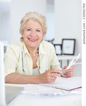 Portrait, smile and old woman with budget documents, savings and taxes in home. Financial planning, face and retirement of senior female person with paper for pension, investment or finance bills. Portrait, smile and old woman with budget documents, savings and taxes in home. Financial planning, face and retirement of senior female person with paper for pension, investment or finance bills. 138992769