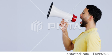 Man, megaphone and studio profile in space, mockup and shout for rally, promo or announcement by background. Speaker, protest or call to action for justice with speech, sound and anger with bullhorn 138992809