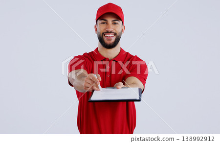 Courier man, clipboard and studio portrait with giving pen for signature, delivery and happy for shipping. Logistics expert, smile and cardboard package for commercial job with document by background Courier man, clipboard and studio portrait with giving pen for signature, delivery and happy for shipping. Logistics expert, smile and cardboard package for commercial job with document by background 138992912