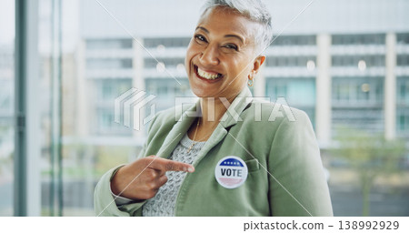 Woman, vote and portrait for politics, pointing and badge for support, government and member. Elections, voter choice and representative for democracy, registration and sticker for voting register Woman, vote and portrait for politics, pointing and badge for support, government and member. Elections, voter choice and representative for democracy, registration and sticker for voting register 138992929