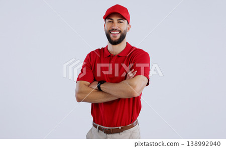 Happy man, portrait and professional delivery guy with arms crossed in confidence against a gray studio background. Male person, model or courier worker smile with red hat for service on mockup space Happy man, portrait and professional delivery guy with arms crossed in confidence against a gray studio background. Male person, model or courier worker smile with red hat for service on mockup space 138992940