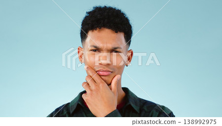Thinking, confused and portrait of man with doubt in studio isolated on a blue background mockup space. Face, idea and person with question, contemplating and problem solving, choice and decision 138992975