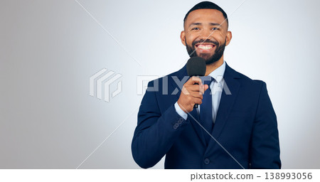Portrait, microphone and corporate businessman in studio with smile, pride and professional news anchor. Happy man, reporter or broadcast journalist with mic on white background with mock up space. Portrait, microphone and corporate businessman in studio with smile, pride and professional news anchor. Happy man, reporter or broadcast journalist with mic on white background with mock up space. 138993056