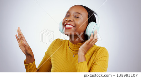 Jazz, music or headphones with black woman, smile or peace in studio for streaming online radio. Relax, grey background or happy African girl listening to track, song or audio podcast on mobile app Jazz, music or headphones with black woman, smile or peace in studio for streaming online radio. Relax, grey background or happy African girl listening to track, song or audio podcast on mobile app 138993107