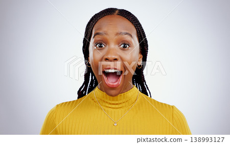 Woman, portrait and wow in studio for surprise, college discount and announcement of win by white background. Young student, african person and shocked face for savings, promotion and mock up space Woman, portrait and wow in studio for surprise, college discount and announcement of win by white background. Young student, african person and shocked face for savings, promotion and mock up space 138993127