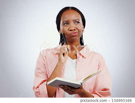 Woman, notebook and thinking, planning or learning and studying with solution or goals on a white background. African student for problem solving with notes and why face, confused or ideas in studio Woman, notebook and thinking, planning or learning and studying with solution or goals on a white background. African student for problem solving with notes and why face, confused or ideas in studio 138993166