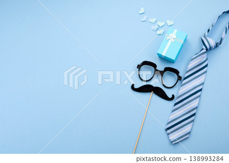 Father's day celebration with gift, tie, mustache, glasses Father's day celebration with gift, tie, mustache, glasses 138993284
