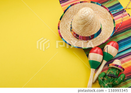 Mexican fiesta celebrating cinco de mayo with sombrero and maracas Mexican fiesta celebrating cinco de mayo with sombrero and maracas 138993345