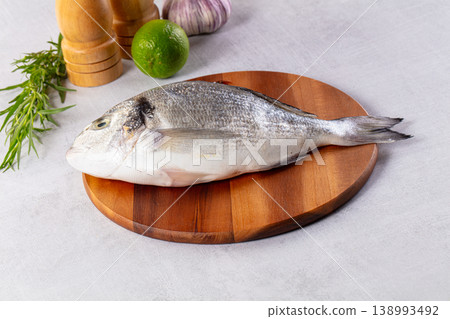Raw fresh uncooked dorada fish Raw fresh uncooked dorada fish 138993492