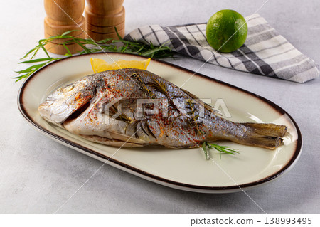 Baked dorada fish with spices Baked dorada fish with spices 138993495