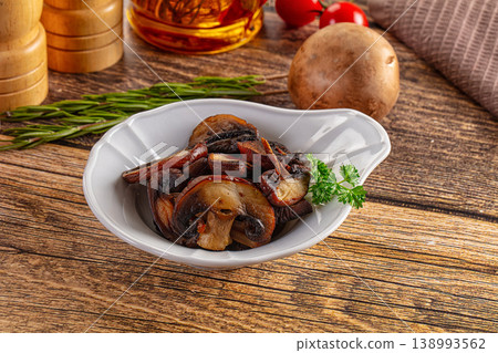 Fried champignon slices in the plate Fried champignon slices in the plate 138993562