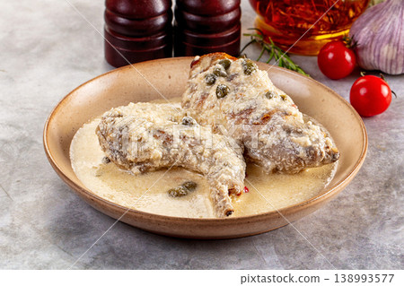Roasted rabbit legs in cream sauce Roasted rabbit legs in cream sauce 138993577