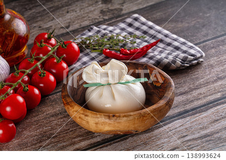 Fresh tasty burrata italian cheese Fresh tasty burrata italian cheese 138993624