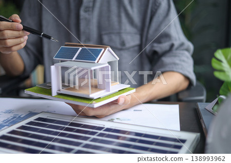 Architect Planning a Modern Solar Power House. Architect Planning a Modern Solar Power House. 138993962