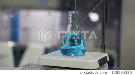 Sciene laboratory. Close up of Modern laboratory scenes with glassware tube reactors and colorful liquids in testing and analysis processes. Chemistry research pharmaceuticals biotechnology concepts. Sciene laboratory. Close up of Modern laboratory scenes with glassware tube reactors and colorful liquids in testing and analysis processes. Chemistry research pharmaceuticals biotechnology concepts. 138994320