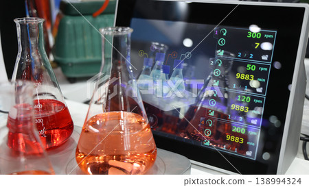 Sciene laboratory. Close up of Modern laboratory scenes with glassware tube reactors and colorful liquids in testing and analysis processes. Chemistry research pharmaceuticals biotechnology concepts. Sciene laboratory. Close up of Modern laboratory scenes with glassware tube reactors and colorful liquids in testing and analysis processes. Chemistry research pharmaceuticals biotechnology concepts. 138994324