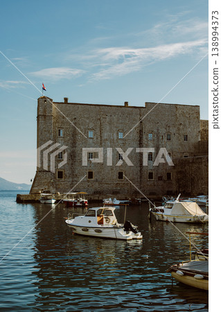 Amazing view of Dubrovnik and the boat in a marina on a sunny day. Travel destination in Croatia. Amazing view of Dubrovnik and the boat in a marina on a sunny day. Travel destination in Croatia. 138994373