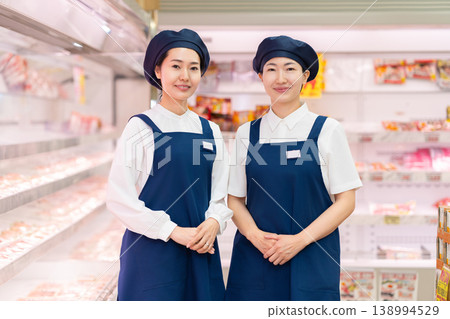 People working in supermarkets People working in supermarkets 138994529