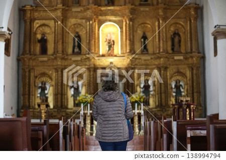Senior woman praying at the beautiful historical Our Lady of the Rosary Church built in 1604 in the colonial town of Villa de Leyva in Colombia Senior woman praying at the beautiful historical Our Lady of the Rosary Church built in 1604 in the colonial town of Villa de Leyva in Colombia 138994794
