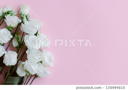 Beautiful white Eustoma (Lisianthus) flowers on a pastel background. Beautiful white Eustoma (Lisianthus) flowers on a pastel background. 138994810