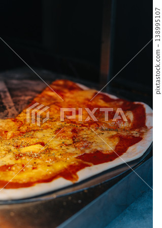 Delicious pizza Margarita in a traditional Italian pizzeria. Delicious pizza Margarita in a traditional Italian pizzeria. 138995107