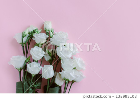 Beautiful white Eustoma (Lisianthus) flowers on a pastel background. Beautiful white Eustoma (Lisianthus) flowers on a pastel background. 138995108