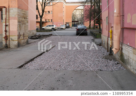 Freshly repaired driveway with scenic archway and city life details Freshly repaired driveway with scenic archway and city life details 138995354