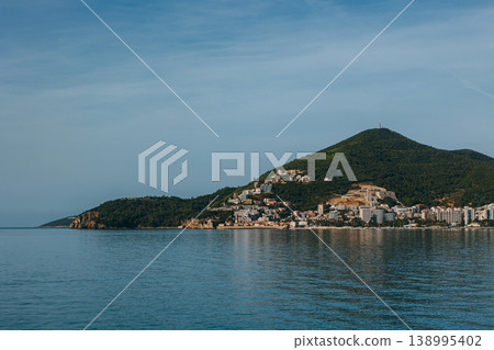 Amazing view of the Adriatic sea and mountains in Becici near Budva. Travel destination in Montenegro. Amazing view of the Adriatic sea and mountains in Becici near Budva. Travel destination in Montenegro. 138995402
