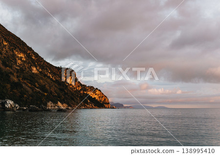 Amazing view of an Adriatic sea on a sunset, Montenegro. Beautiful cloudy sky. Amazing view of an Adriatic sea on a sunset, Montenegro. Beautiful cloudy sky. 138995410