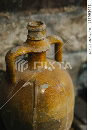 Vintage wine bottle in a basement. Old jug. 138995638