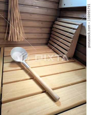 Wooden sauna interior with ladle and headrest Wooden sauna interior with ladle and headrest 138995791