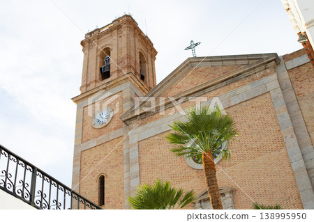 Historic church bell tower and facade in Altea, Spain, a popular destination for travel and tourism during family holidays 138995950