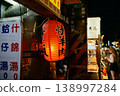 Red lanterns and food stalls at a Taiwanese night market. 138997284