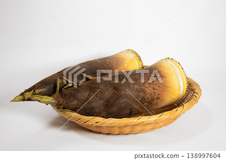 Two bamboo shoots placed on a sieve Two bamboo shoots placed on a sieve 138997604