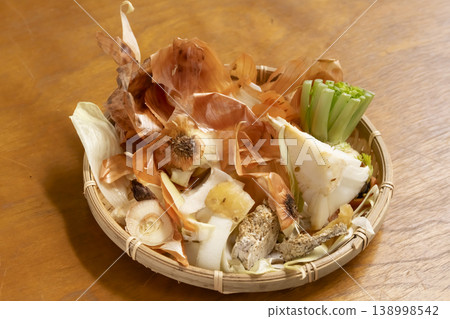 Vegetable scraps in a colander Vegetable scraps in a colander 138998542