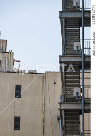 The back of a city building and an exterior staircase The back of a city building and an exterior staircase 138998773