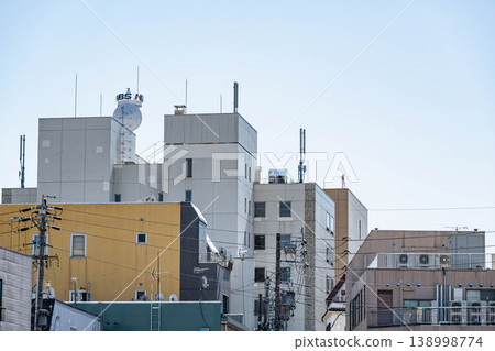 The back of a multi-tenant building in the city and a fire escape 138998774
