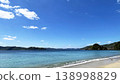 Yadori Beach on Amami Oshima Island: A breathtaking landscape of blue ocean and lush green islands. 138998829