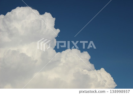 A summer landscape of blue skies and white cumulonimbus clouds. A summer landscape of blue skies and white cumulonimbus clouds. 138998937