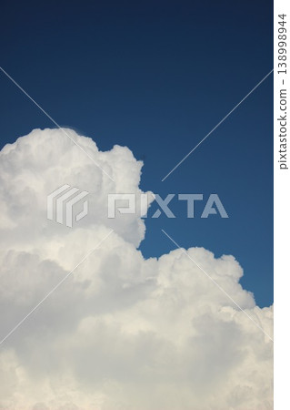 A summer landscape of blue skies and white cumulonimbus clouds. A summer landscape of blue skies and white cumulonimbus clouds. 138998944